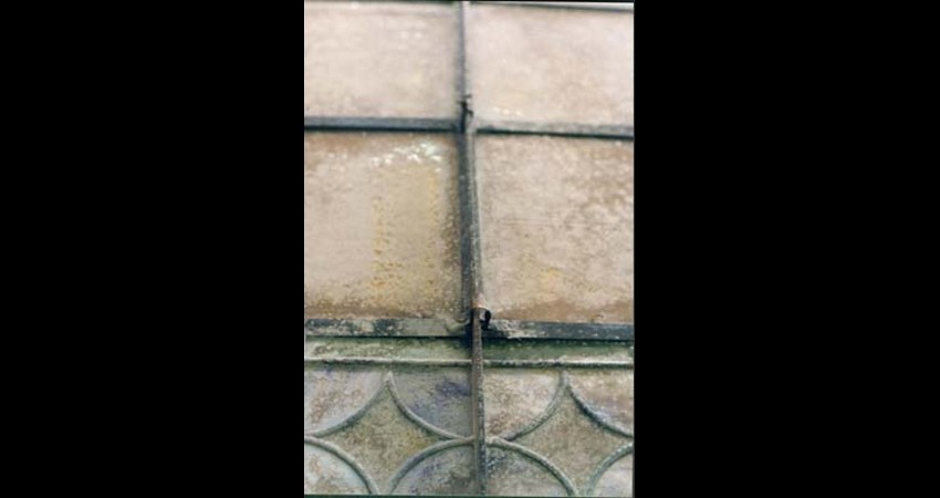Federal Building, Collingwood Ontario EGD Glass Restoration - Rust and buckling of the steel frame, deterioration of the lead came matrix, and breakage of glass had occurred
